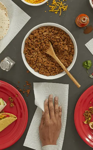 Mexican taco night with red paper plates and side dishes with Brawny paper towels.