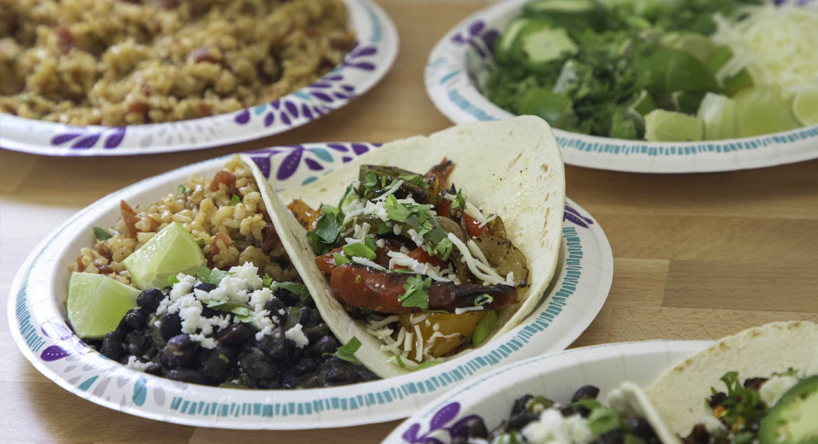 Tofu Sofrita Tacos With Rice And Beans On Dixie Paper Plate.