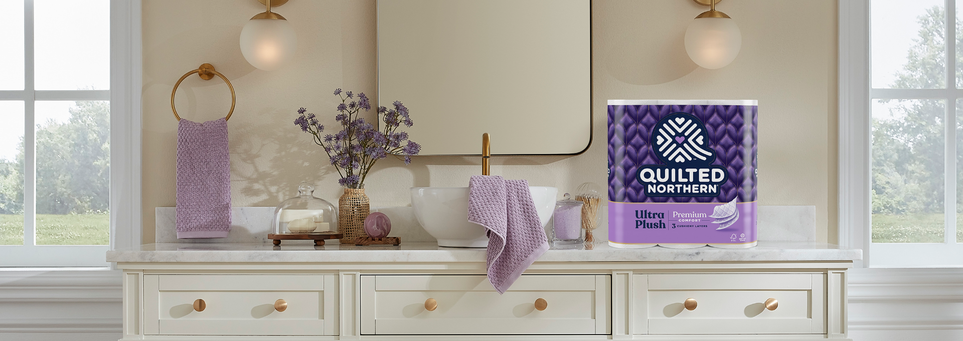 Elegant bathroom counter with Quilted Northern Ultra Plush toilet paper on counter.