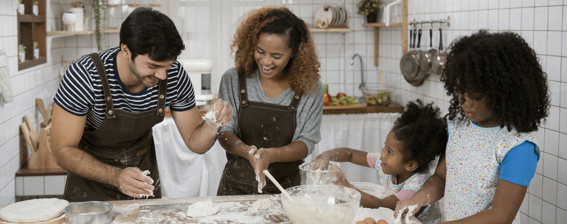 Family making bread dough.