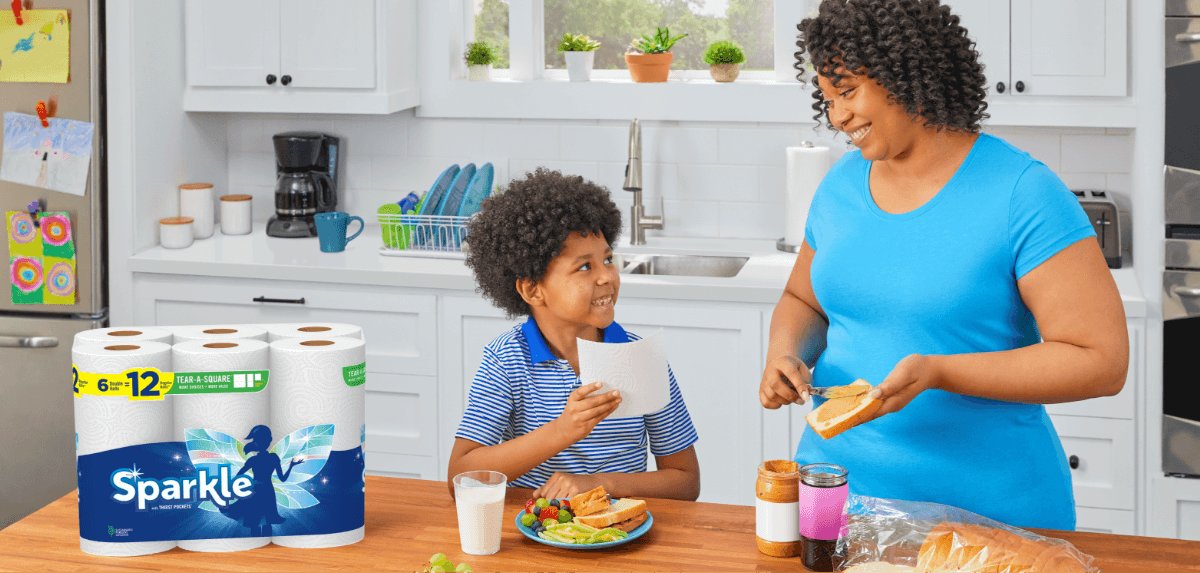 Mother and son making sandwiches next to a package of Sparkle paper towels.