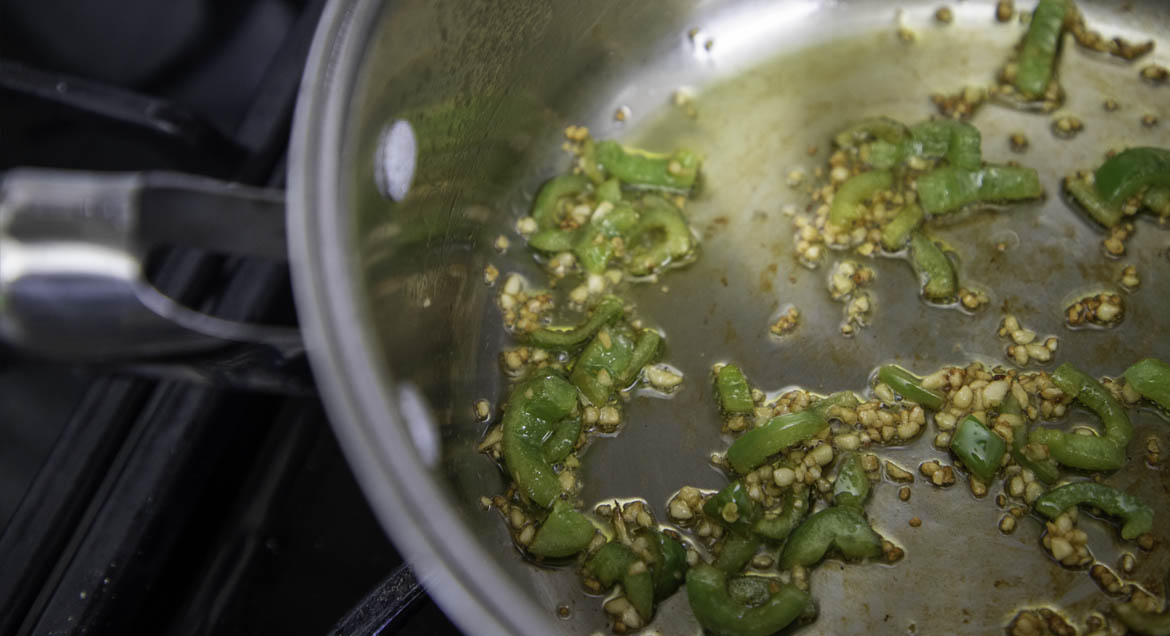 Jalapeños In Frying Pan For Tofu Sofrita Tacos.